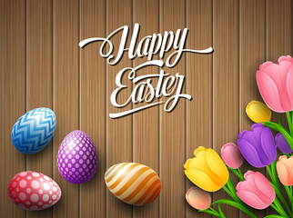 Happy Easter colorful egg with tulips flower beautifully above wooden brown background