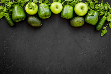 Greeny cocktail ingredients. Fitness smoothie. Cucumber, pepper, apple, celeriac on black background top view space for text
