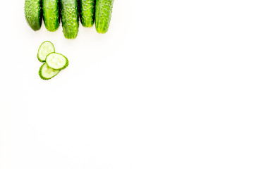 Cucumber. Vegetables for greeny organic smoothy for sport diet on stone background top view mockup