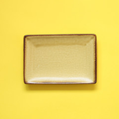 Yellow dish isolated on yellow background