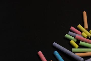 Colored crayons on a blackboard.
