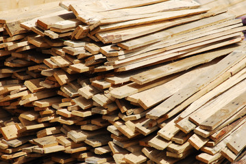 close up on stacking wood at construction site