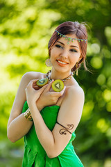 Beautiful young asian woman with kiwi