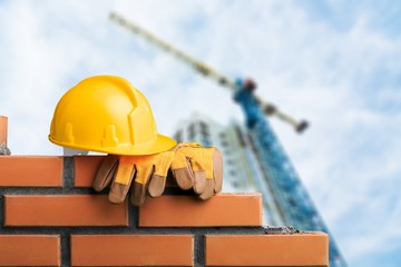 Yellow helmet with equipment on construction