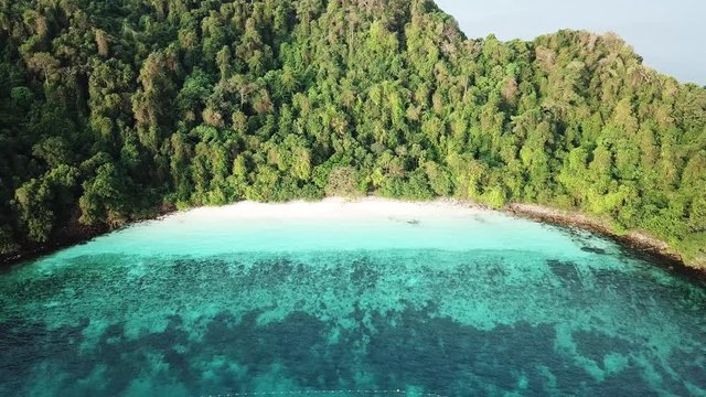 Aerial view from a drone of beautiful Nyaung Oo Phee island on sunny day in Myanmar

