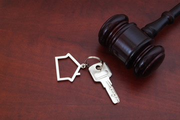 Judge gavel and key with kechain,  justice and real estate concept