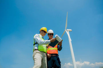 Male Engineer or technician at Work wind turbine station,wind enegy concept