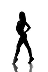 Fototapeta na wymiar sport woman full length portrait, silhouette studio shot over white background