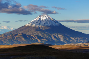 Autumn mountain landscape: scenery evening view of snow-capped cone of Vilyuchinsky Volcano on...