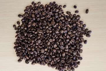 Close up coffe beans background on a table with copy space.