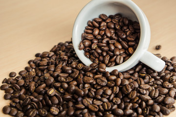 Close up coffe beans in the cop of coffee drop on the coffee beans.
