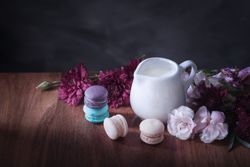macarons or macaroons and milk on wooden dessert sweet beautiful to eat