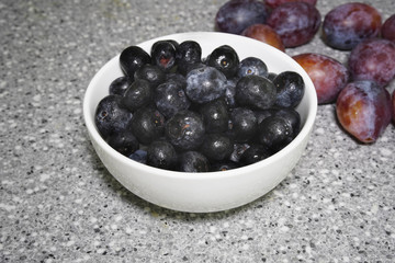 berries in a bowl on the bench