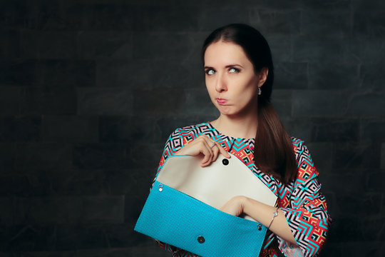Unhappy Fancy Woman Checking Inside Empty Bag  
