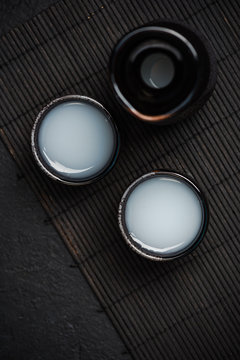 Sake in ceramic bowls, top view