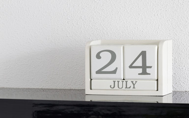 White block calendar present date 24 and month July
