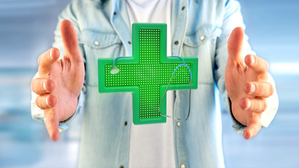 Businessman holding a Lighting pharmacy cross and a stethoscope - 3d render