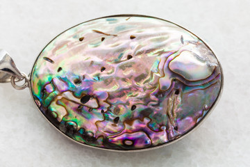 pendant from Abalone (haliotis) shell on white