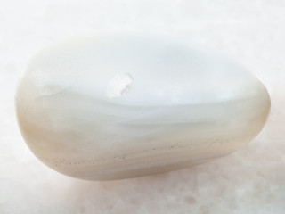 polished white Agate gemstone on white