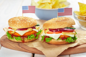 Fast food, homemade burger on a wooden background