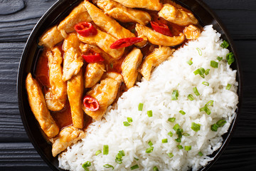 Thai food: Panang curry with rice close-up. horizontal top view from above
