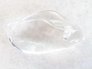 tumbled clear Quartz (rock-crystal) stone on white