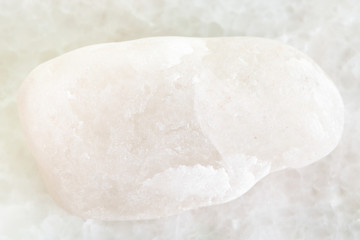 pebble of white marble on white marble background