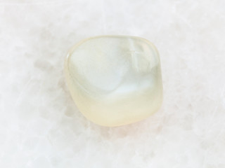 Obraz na płótnie Canvas polished translucent moonstone gemstone on white