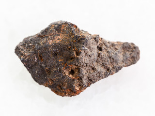 rough Psilomelane (manganese ore) stone on white
