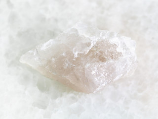rough Quartz stone on white marble