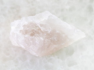 raw Quartz stone on white marble