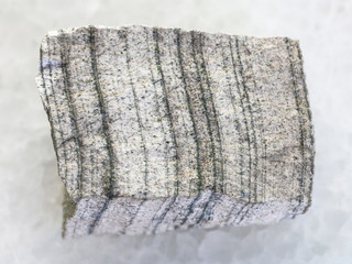 rough Skarn stone on white marble