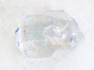 raw crystal of celestine stone on white marble