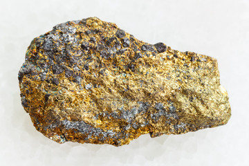 rough pyrite ore on white marble