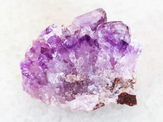 raw Amethyst crystal druse on white marble © vvoe