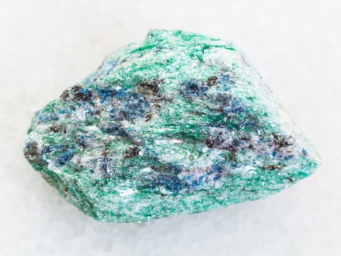 rough Fuchsite (chrome mica) stone on white marble