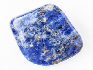 polished Sodalite gemstone on white marble