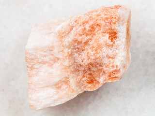 rough Selenite stone on white marble