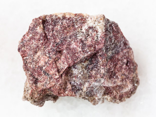 rough pink Dolomite stone on white