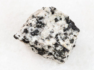 raw white granite stone on white