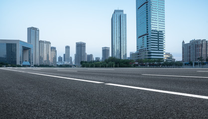 Fototapeta na wymiar empty urban road with city skyline on background，tianjin,China,Asia.