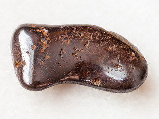 tumbled hydrogoethite stone on white