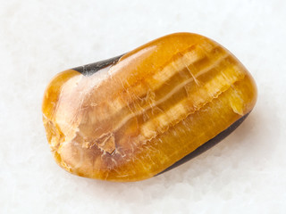 polished simbircite gemstone on white