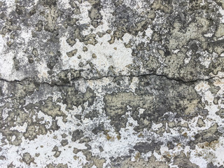 Old stone plastered wall, aged and cracked paint