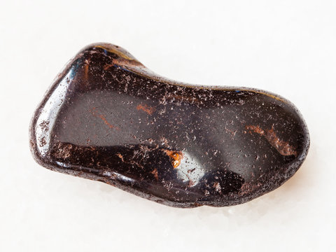 tumbled hydrogoethite gemstone on white