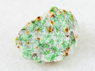 rough Edenite stone on white