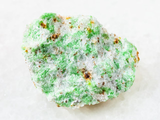raw Edenite stone on white