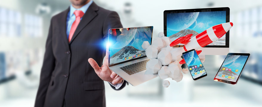 Businessman connecting tech devices and startup rocket 3D rendering