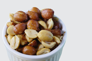salted peanuts in a white bowl