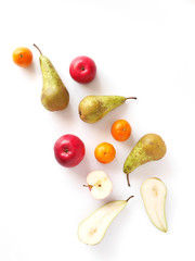 Various fruits: pears, apple, tangerines isolated on white background, top view, flat layout. Composition of various fruits with copy space.